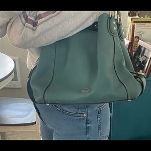 Authentic Coach bucket bag with multiple compartments. Barely used